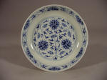 光緒 An Imperial Guangxu mark and period blue & white saucer decorated with lotus & tendril design