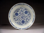 道光 A Daoguang mark and period blue & white saucer decorated with lotus & tendril design