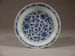 康熙 An Imperial Kangxi mark and period blue & white saucer decorated with lotus & tendril design