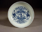 道光 An Imperial mark & period Daoguang blue and white saucer dish decorated with phoenix birds