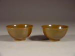 A pair of mark & period Guangxu bowls covered in a deep tone cafe au lait brown glaze