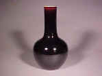 A large 光緒 Guangxu mirror black bottle vase with an apocryphal 康熙 Kangxi mark